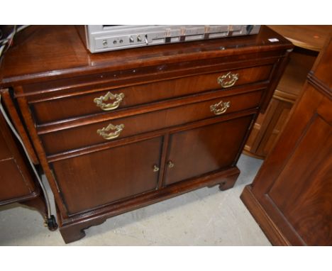 A vintage reproduction side cabinet in the Georgian style