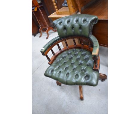 A reproduction button back green leather office chair