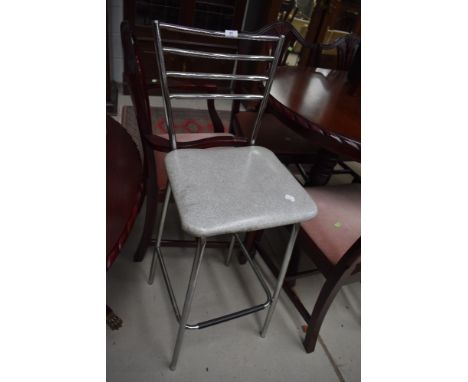 A vintage style chrome frame kitchen bar stool with vinyl seat