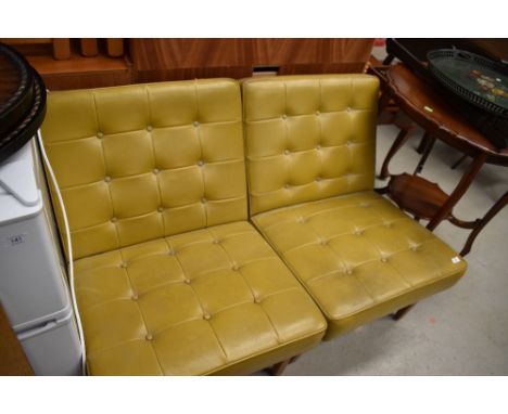 A pair of vintage mustard vinyl easy chairs having button seats, approx dimensions W59cm Seat Height 42cm Back Height 72cm
&n