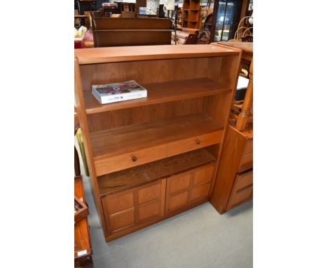 A teak Nathan bookshelf of shallow proportions with drawers and cupboard section