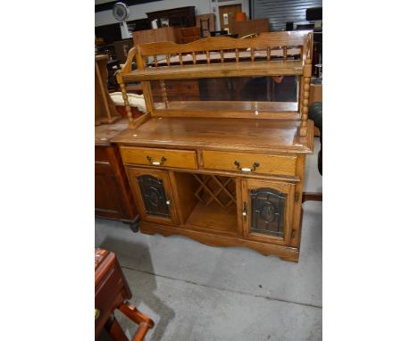 A vintage colonial style sideboard having mirror and shelf back, width approx. 124cm