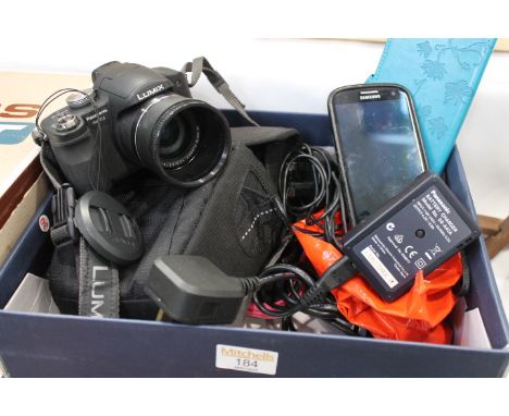 Samsung mobile phone together with a Panasonic Lumix digital camera