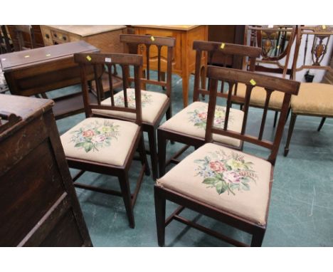 Four Victorian mahogany dining chairs with tapestry upholstered seats and raised on square legs.  Height 84 cm, width 49 cm, 