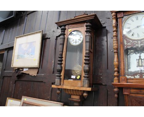 Wall clock with enamelled dial and pendulum with cat decoration 