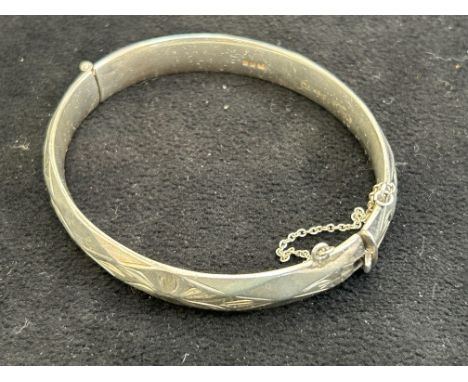 Silver bangle with safety chain Weight 45g 