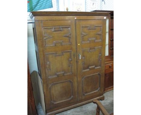 17TH CENTURY STYLE OAK GEOMETRICALLY PANELLED TWO DOOR WARDROBE.  53 x 20 x 71". CONDITION REPORT: Marks and wear and tear co