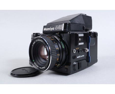 A Mamiya 645 Super Camera, serial no 223416, with power grip. shutter working, body G, some light scratches to base, top of v