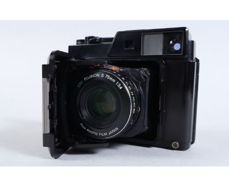 A Fujica GS645 Professional Camera, serial no 3020152, shutter working, meter responsive, body G, kight wear, bellows G, some