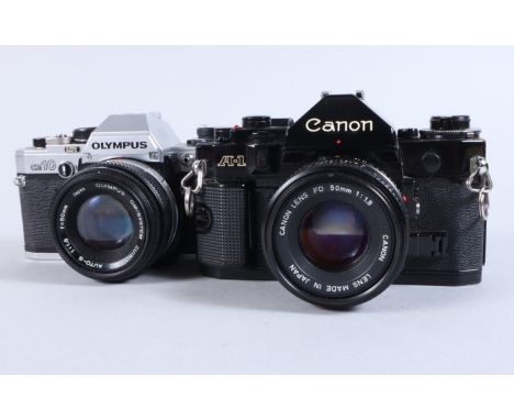 A Canon A1 and an Olympus OM10 SLR Cameras, A1 serial no 967727, body G, shutter working, meter responds to light, with an FD