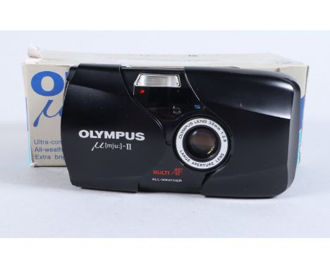 An Olympus mju II Compact Camera, serial no 70696713, powers up, shutter fires, flash working, self timer working,  body VG, 