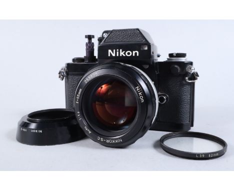 A Nikon F2 Photomic SLR Camera, black, serial no 7359217, shutter working, self timer working, with long shutter button attac