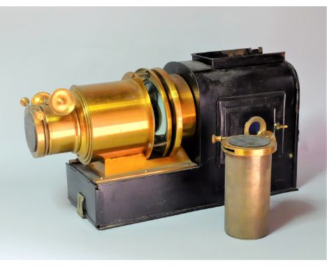 An early 20th Century Wrench/Riley Lacquered Brass and Russian Iron Magic Lantern,  with 8½in. and 12½in. lenses, F, iron ove