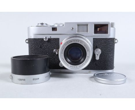 A Leitz Wetzlar Leica M2 Camera, chrome, serial no 932 890, 1958, shutter working, brown glass tinge inside viewfinder, range