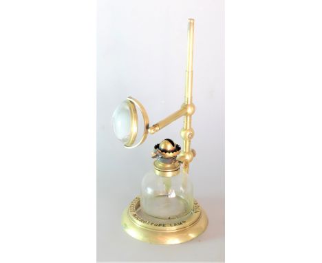 A late 19th Century lacquered brass Collins Bockett Microscope Lamp,  engraved 'Collins London Bockett Microscope Lamp, with 