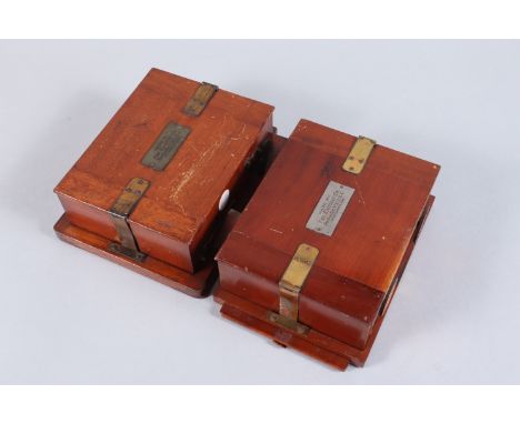 Two Eastman Kodak Film Backs, quarter plate, serial numbers 5757 and 5837, with dark slides and internal wooden spools, condi