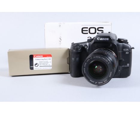 A Canon EOS 30 SLR Camera, serial no 71003702, body G, slight tackiness to front leatherette, shutter working, meter reacts t