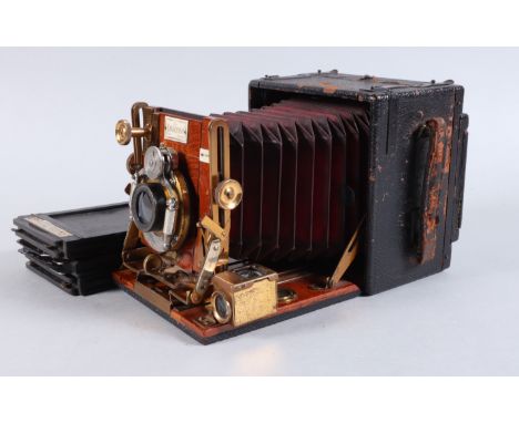 A Sanderson Regular Hand and Stand Camera, quarter plate, serial number 20294, body F, damage to leatherette, bellows G, lens