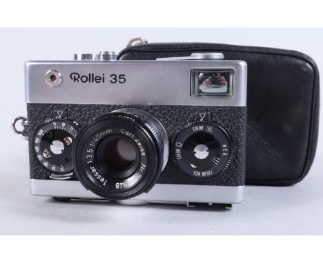 A Rollei 35 Compact Camera, made in Singapore, shutter working, meter responsive, body G, elements G, some fungus, in case wi