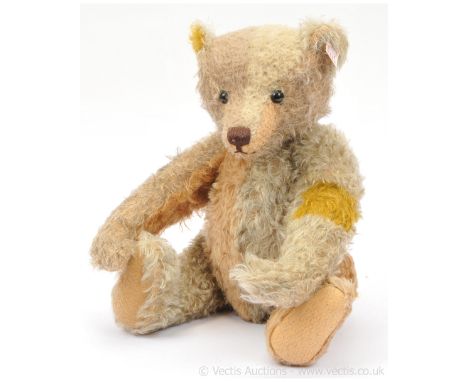 Steiff Reinhard, the Schulte patchwork teddy bear, white tag 036477, LE 1901, 2010, consisting eleven patchwork swatches sewn