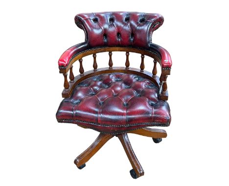 Ox blood buttoned leather Captains style swivel desk chair.