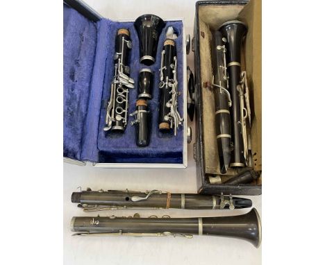 Boosey &amp; Hawkes Regent clarinet in case, and two vintage clarinets.