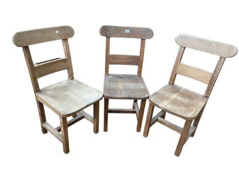 Set of three vintage oak chapel chairs.