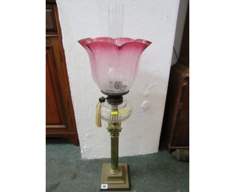 ANTIQUE OIL LAMP, brass column base oil lamp with cut glass reservoir and frosted cranberry shade 