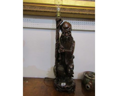 EASTERN CARVING, 19th Century carved cherry root Sage figure lamp base, 56cm height 