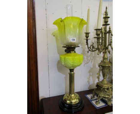 ART NOUVEAU OIL LAMP, an attractive brass column base oil lamp with yellow glass reservoir and acid etched crinoline shade