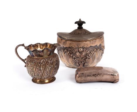 A Victorian silver tea caddy, Birmingham 1894, oval, with hinged cover, embossed with formal leafage and flowers, 9cm high a 