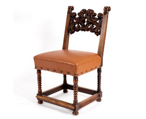 A walnut side chair, North Italian style, mid 17th Century, the elaborate scrolled back flanked by scrolled uprights, the stu