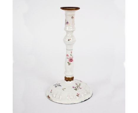 A South Staffordshire white enamel candlestick, circa 1780, painted with simple flower sprays, 14.5cm high/Provenance: Spetch
