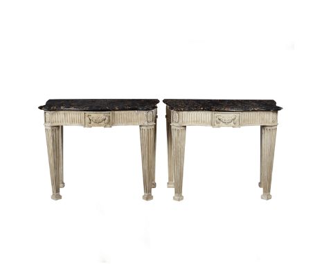 A pair of painted console tables with Portor marble tops, the serpentine tops probably 18th Century, each on estate made base