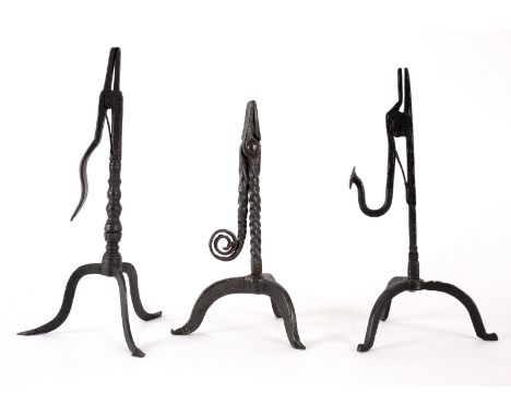 An 18th Century style wrought iron rush-light holder with scroll termination to the twist handle, on a column with tripod bas