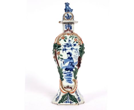 A Dutch Delft polychrome vase, circa 1780, painted a Chinaman, the cover with dog finial/Provenance: Spetchley Park CONDITION