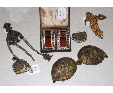 A pair of gilt-metal and paste buckles in a fitted box 11.5cm wide, a gilt-metal clasp, possibly Indian, 10cm wide, another c