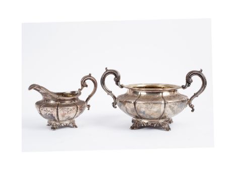 A Victorian silver milk jug and sugar basin, Bateman & Ball, London 1840, of fluted melon shape, engraved with formal leafage