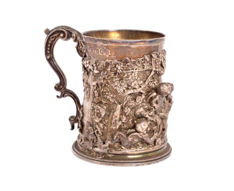 A Victorian Britannia silver mug, R. Garrard, London 1851, tapered cylindrical, applied in bold relief with winged infant bac