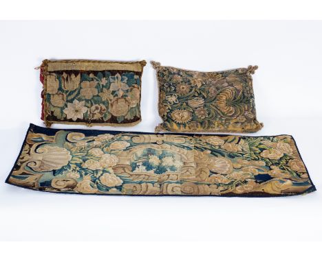 A French tapestry border fragment, 17th Century, worked with cartouches with trees, 129cm x 51cm and two French verdure tapes