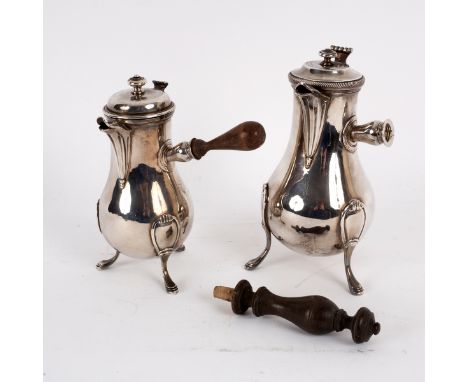 A near pair of French silver coffee pots, one possibly by J L A Leguay, Paris 1789, of baluster form, the handles at right an