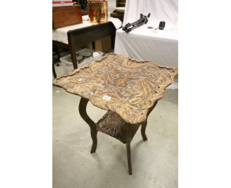 Well carved side table with floral / foliage design