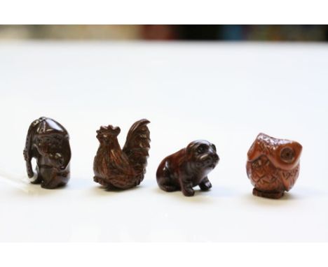 Four miniature wooden netsuke figures 