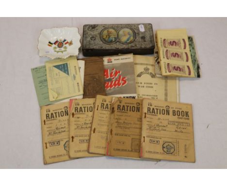 A Selection of Military ephemera to include postcards, ration books and civil defence etc, to also include a WW1 ashtray and 