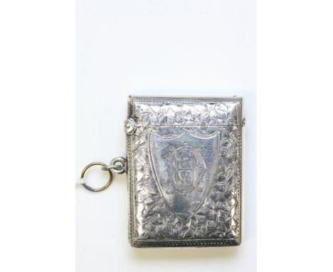 A silver vesta with floral engraving 