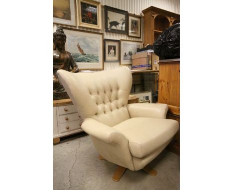 1960's Style Wingback Swivel Armchair upholstered in Cream Leather with Button Back on an Oak Swivel Base