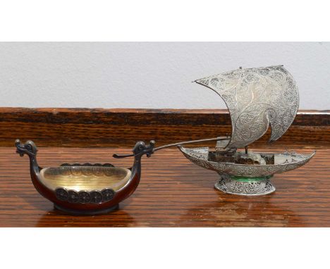 Two silver and enamel model boats. The first with red enamel detailing, bearing Swedish marks and stamed 925 Sterling Norway,