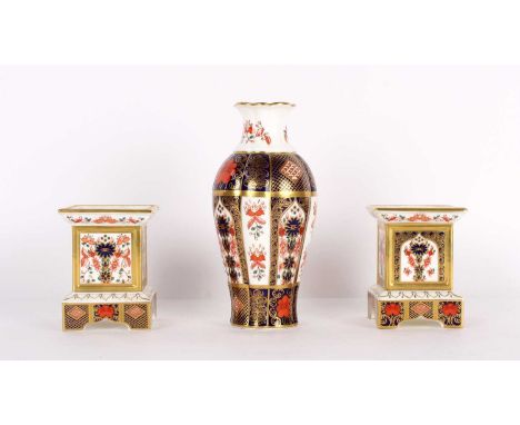 A Pair of "Old Imari" Candlesticks and a Vase by Royal Crown Derby A Pair of "Old Imari" Candlesticks and a Vase by Royal Cro
