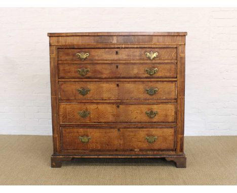 A George III Oak Secretaire Chest A George III Oak Secretaire Chest, the faux drawer fall front enclosing a fitted interior a