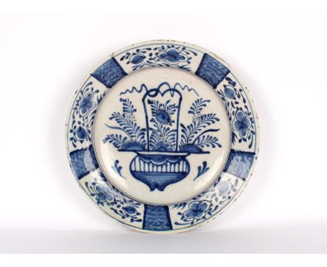 An 18th Century Dutch Delft Charger An 18th Century Dutch Delft Charger, decorated in blue and white in the Chinese style, un